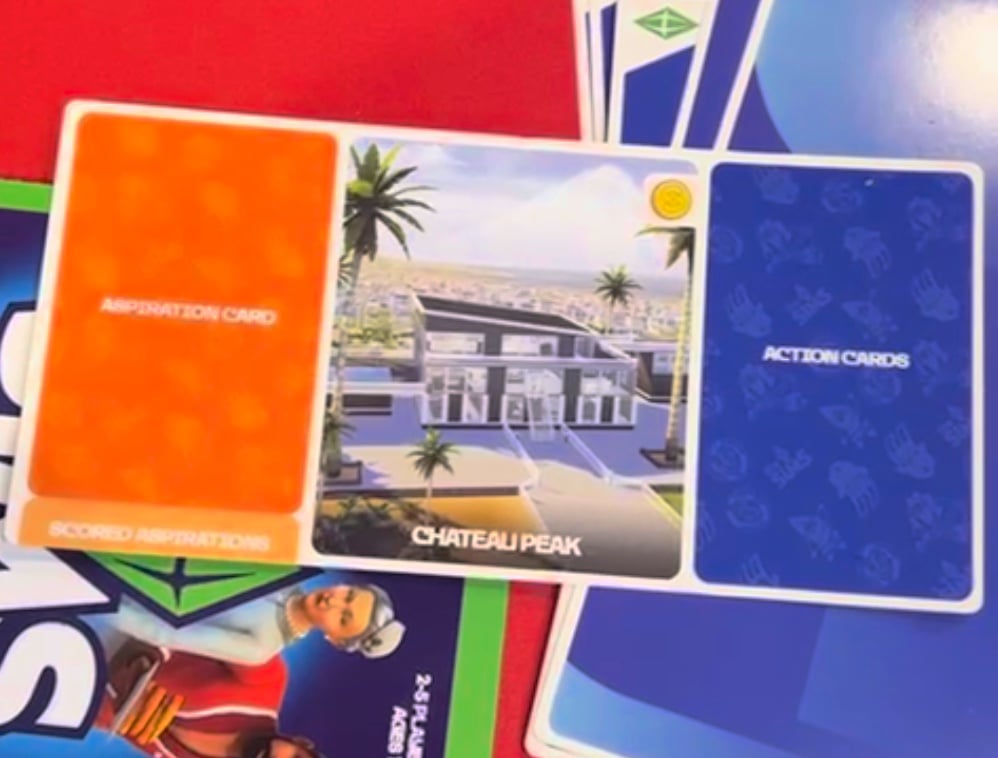 The Sims Board Game: Gameplay Review & Release Date 8 Your Game card showing where to put aspiration cards action cards and completed aspirations