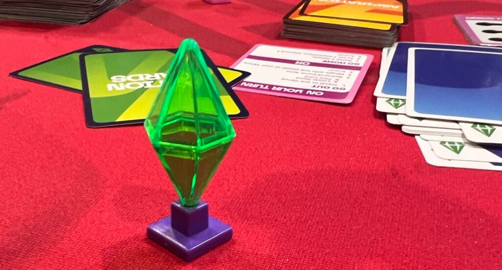The Sims Board Game: Gameplay Review & Release Date 7 Sims Board Game Preview plumbob board piece and cards