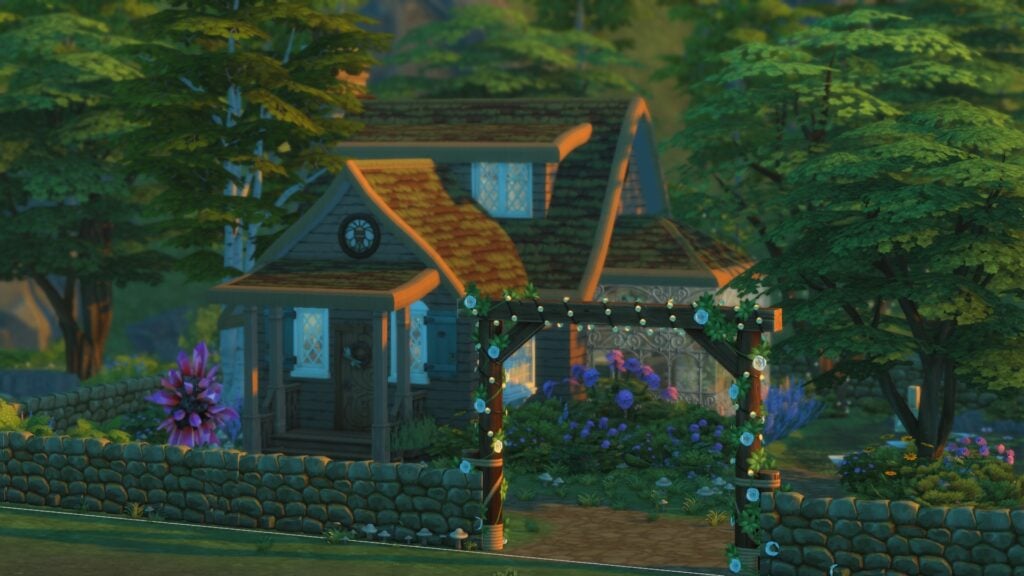 The Sims 4 Glass Walls Build Tips: Through the Simming Glass 20 Exterior of cottage with greenhouse on the side surrounded by flowers and bushes