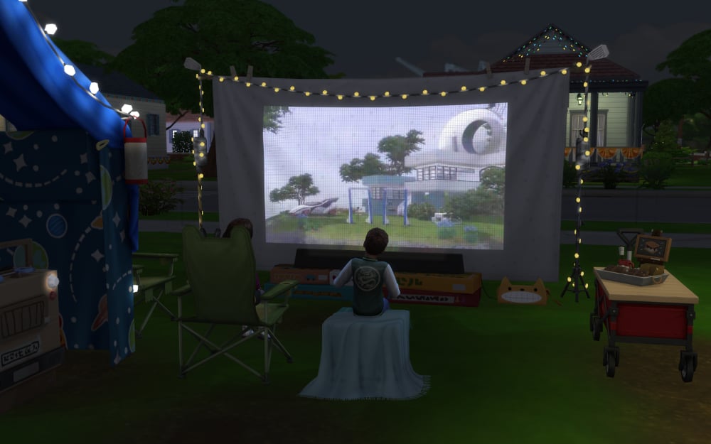 Sims watching an outdoor movie