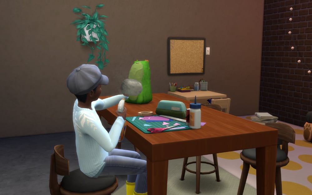 Sim creating Papier-Mâché