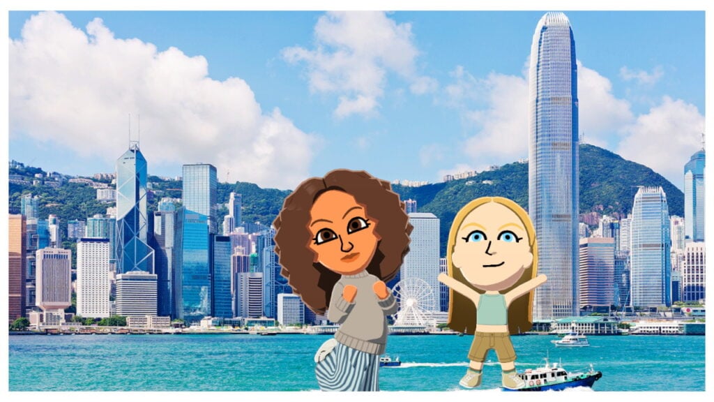 Two miis stand in front of a body of water, behind which are a bunch of sky scrapers.
