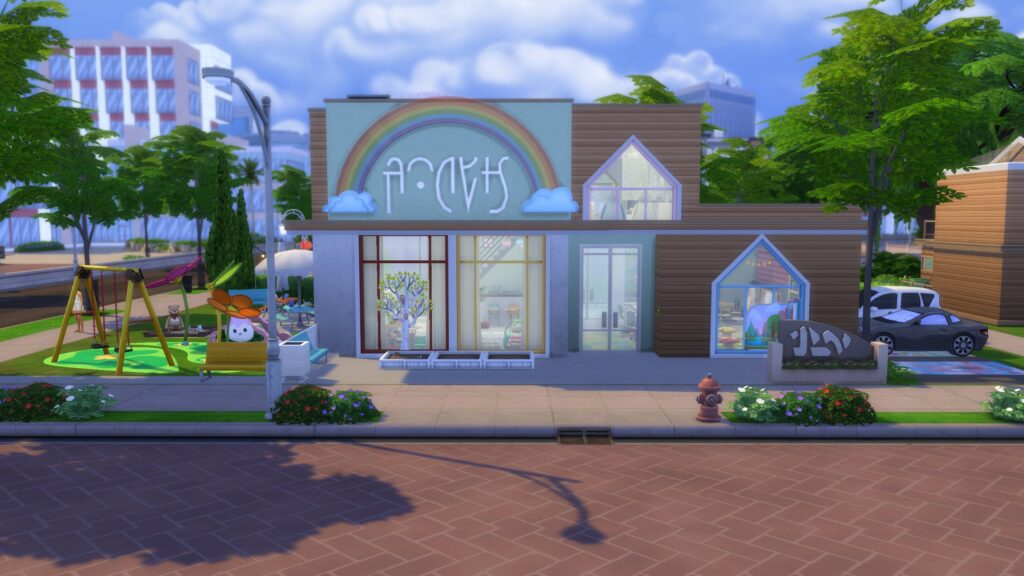 Modern Sims 4 daycare with a rainbow sign, large windows, wooden exterior and colorful outdoor playground.